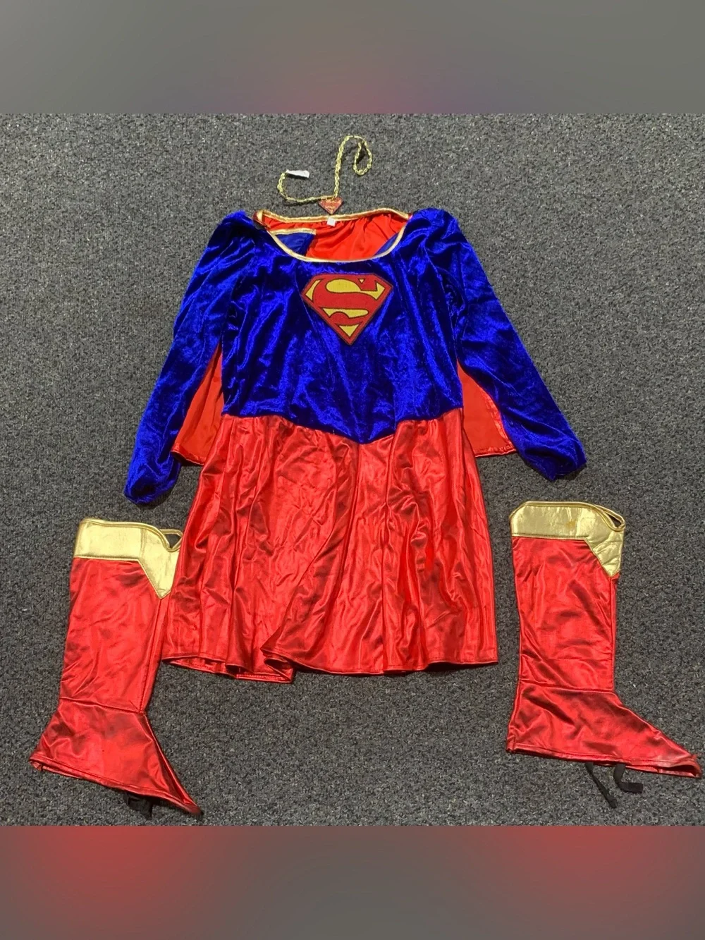 Supergirl size 12/14 costume with cape, shoe coverings and necklace